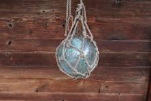 glass float hanging on string